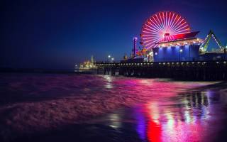 view of a ferris wheel from across some water