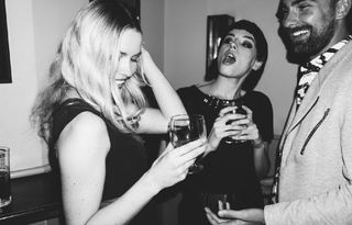 A Group of People Gathering for an Event Toasting Drinks together
