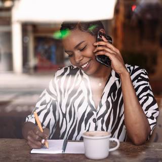 Woman working at table with coffee