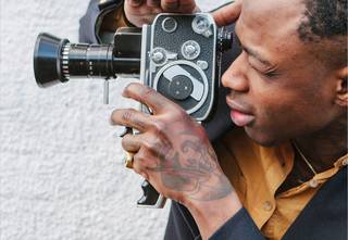 Man holding vintage camcorder
