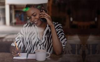 Woman sitting in cafe working