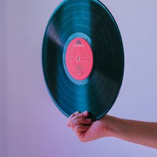 Hand holding LP record