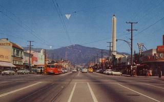 vintage photo of a road with buildings on either side